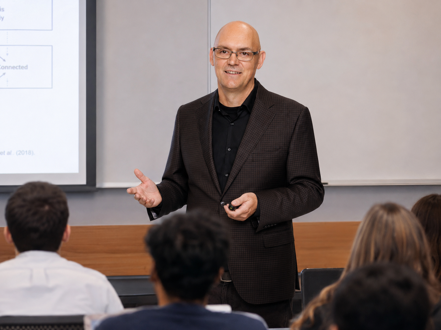 Professor Peter R. Darke lecturing to a room of graduate students